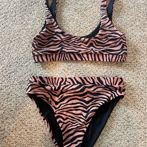 Blushing brunette tiger stripe black and mauve bikini